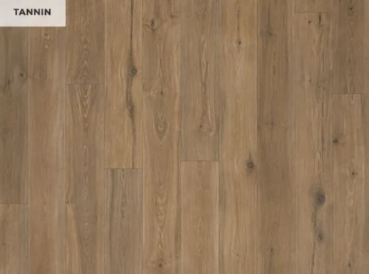 Close-up of Anthology in Tannin, warm brown wood-look planks with knots