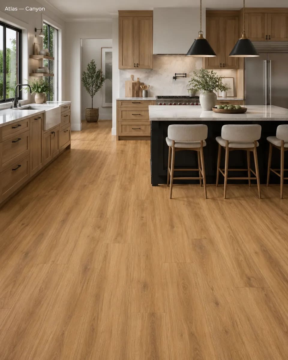 Kitchen with oak cabinets and a black island with stools on honey-toned Atlas Canyon laminate