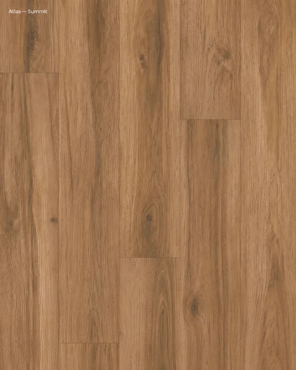 Close-up of Atlas in Summit, warm mid-tone wood-look planks