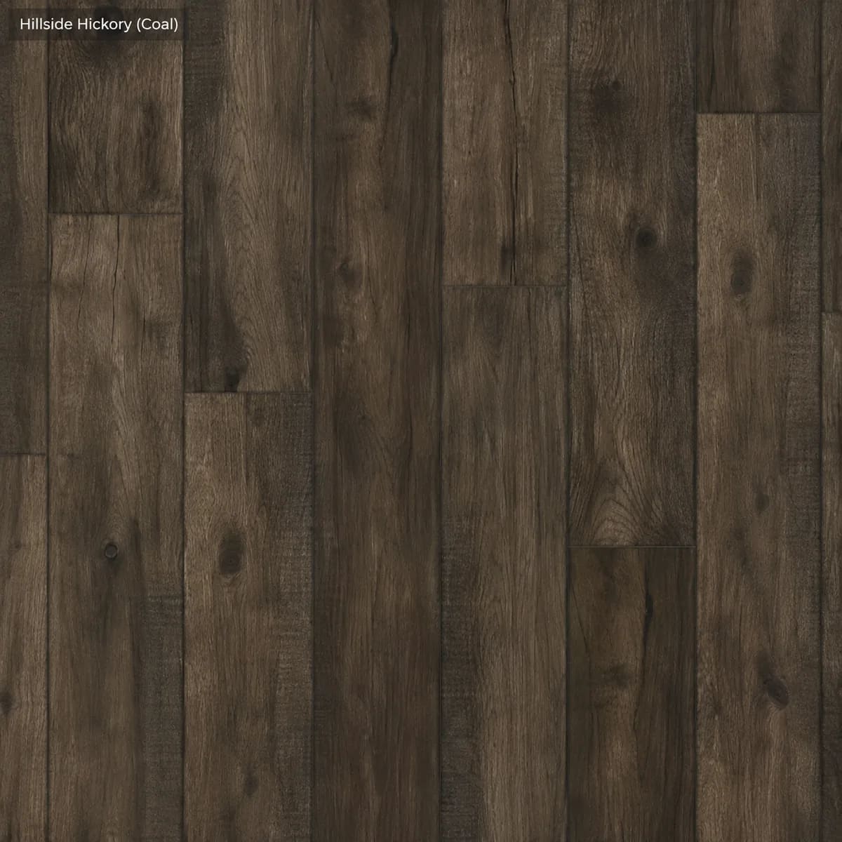 Close-up of Hillside Hickory in Coal, dark charcoal-brown hickory-look planks