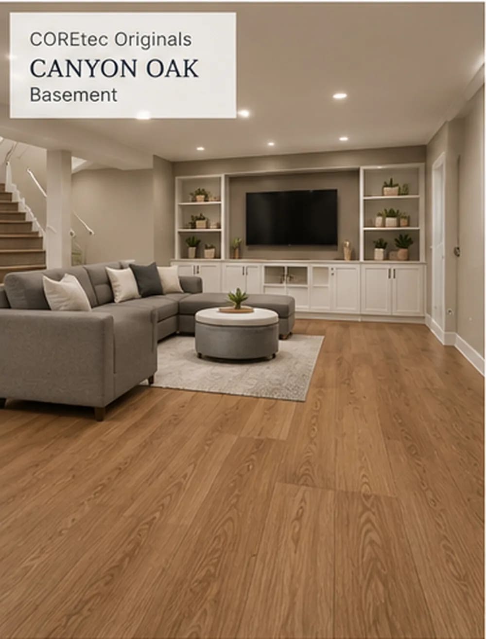 Finished basement with a grey sectional and white built-in shelves on Canyon Oak planks