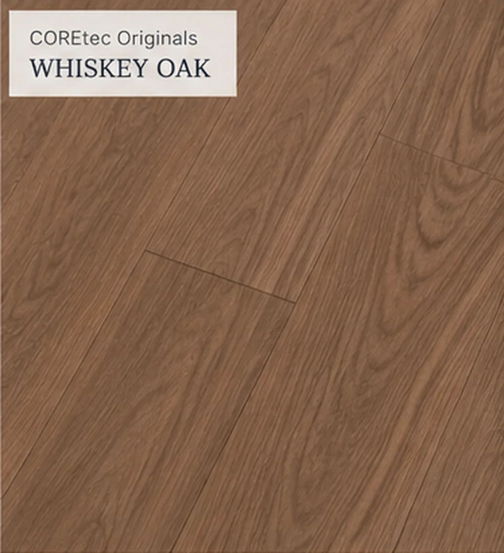 Close-up of Lakehouse Luxe in Whiskey Oak, warm brown wood-look planks