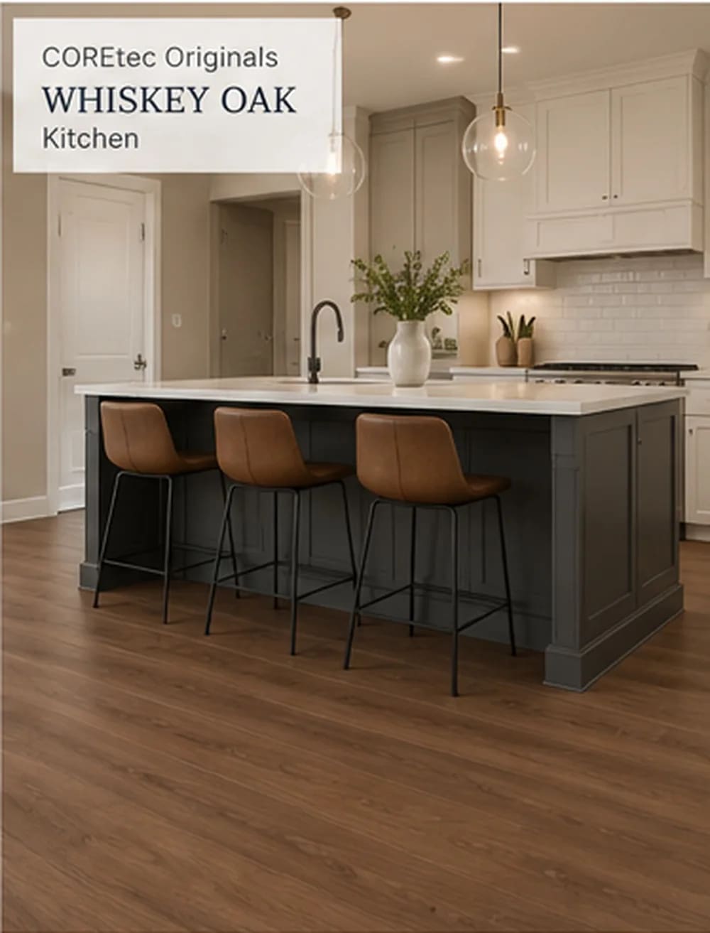 Kitchen with a dark grey island and leather stools on warm brown Whiskey Oak planks