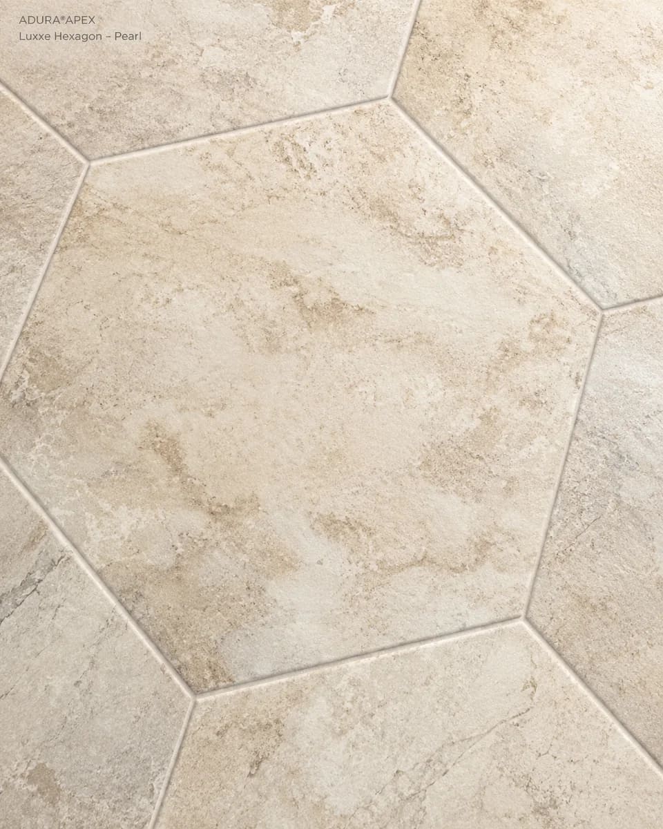 Close-up of Luxxe Hexagon in Pearl, cream stone-look hexagon tiles