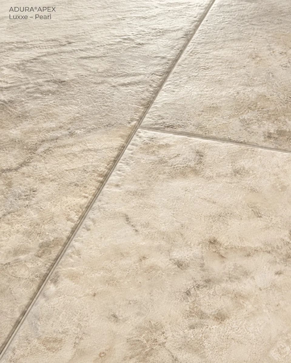 Close-up of Luxxe in Pearl, pale stone-look tiles with tumbled edges