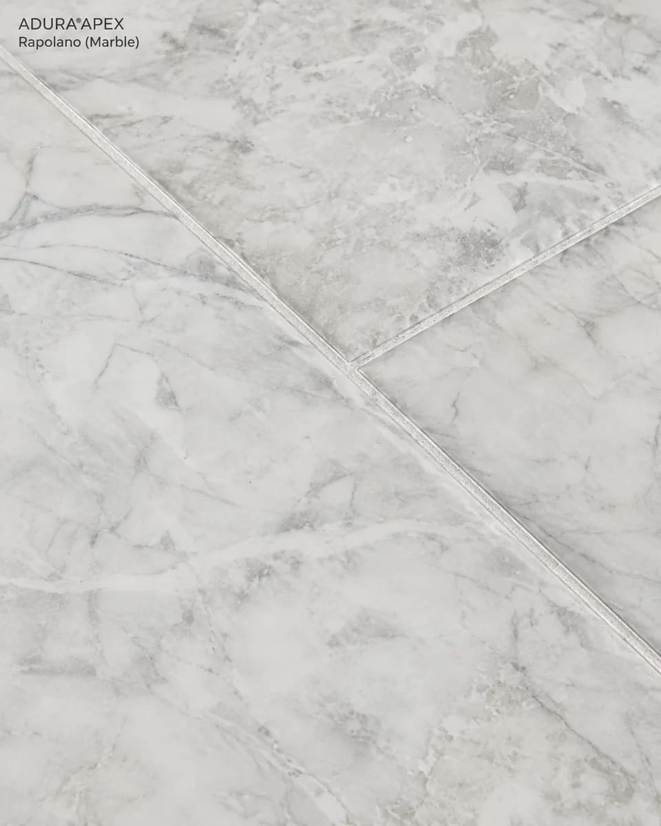 Close-up of Rapolano in Marble, pale grey tiles with soft veining