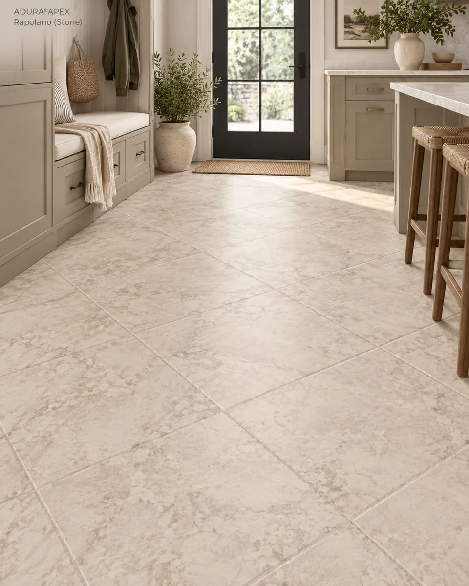 Mudroom with a built-in bench beside a kitchen island on beige Rapolano Stone tiles
